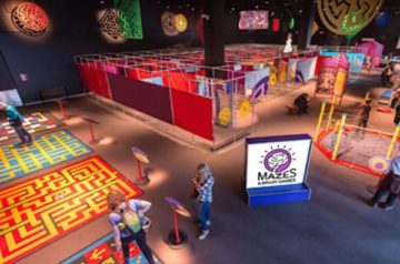 A colossal collection of mind-bending mazes, 3-D puzzles and full-body games that's sure to challenge, entertain and amaze visitors, while stimulating critical thinking and creative problem solving.